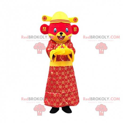 Mascote rato vermelho e amarelo vestido com uma roupa asiática