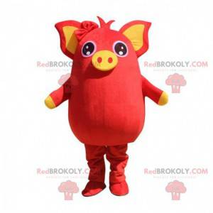Mascotte de cochon rouge et jaune, dodu et divertissant -