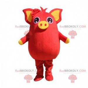 Mascotte de cochon rouge et jaune, dodu et divertissant -