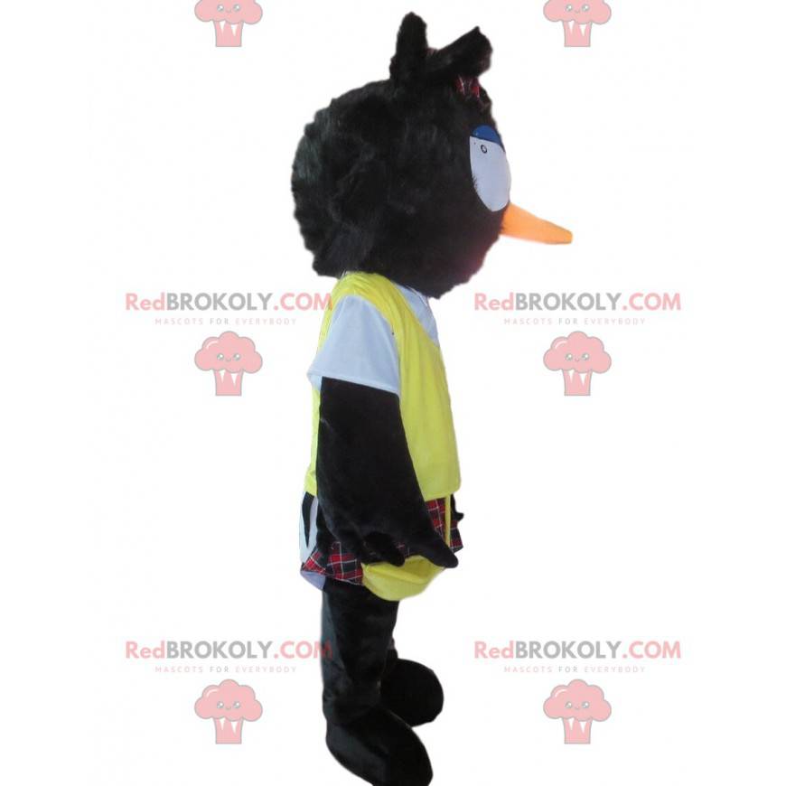 Mascote pássaro preto desgrenhado com saiote e babador amarelo