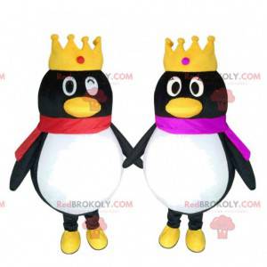 2 penguin mascots with crowns, couple of penguins -
