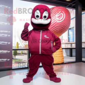 Maroon Snake mascot costume character dressed with a Windbreaker and Mittens