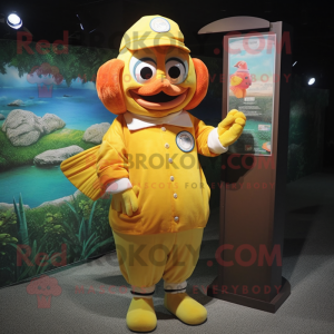 Yellow Clown Fish mascot costume character dressed with a Henley Shirt and Hat pins