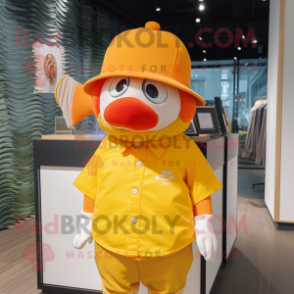 Yellow Clown Fish mascot costume character dressed with a Henley Shirt and Hat pins