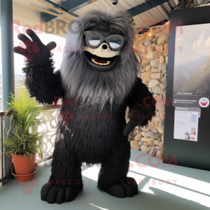 Black Yeti mascot costume character dressed with a Dress Shirt and Eyeglasses