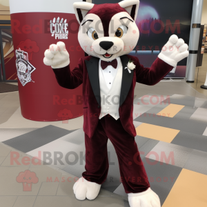 Maroon Lynx mascot costume character dressed with a Tuxedo and Shoe laces