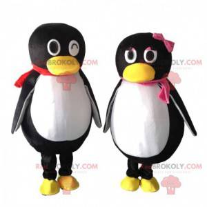 2 mascots of black and white penguins, couple of penguins -