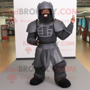 Black Medieval Knight mascot costume character dressed with a Bootcut Jeans and Foot pads