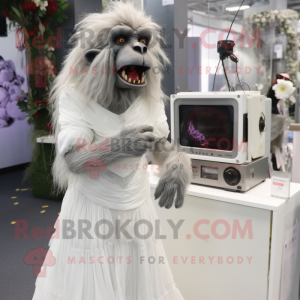 Silver Baboon mascot costume character dressed with a Wedding Dress and Hair clips