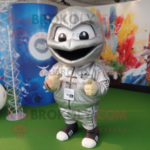 Silver Rugby Ball mascot costume character dressed with a Hoodie and Necklaces