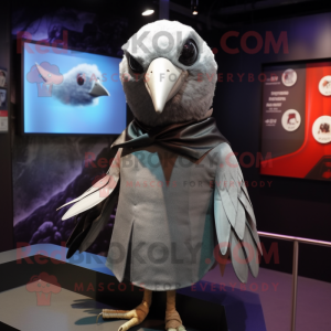 Silver Blackbird mascot costume character dressed with a Blouse and Lapel pins