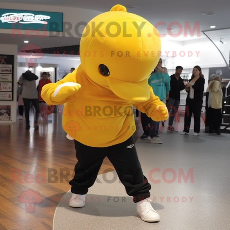 Gold Humpback Whale mascot costume character dressed with a Capri Pants and Beanies