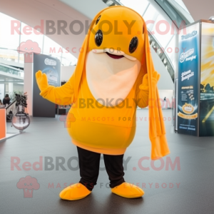 Gold Humpback Whale mascot costume character dressed with a Capri Pants and Beanies