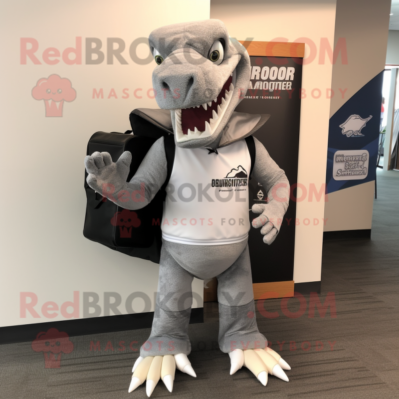 Gray Spinosaurus mascot costume character dressed with a Hoodie and Briefcases Gray Spinosaurus mascot costume character dressed with a Hoodie and Briefcases