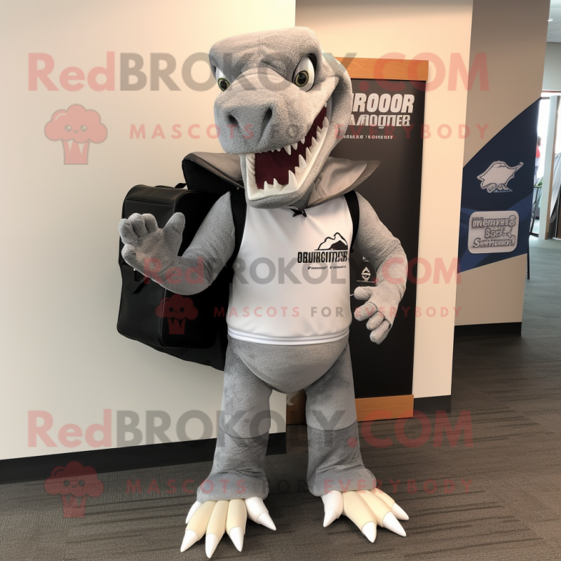 Gray Spinosaurus mascot costume character dressed with a Hoodie and Briefcases