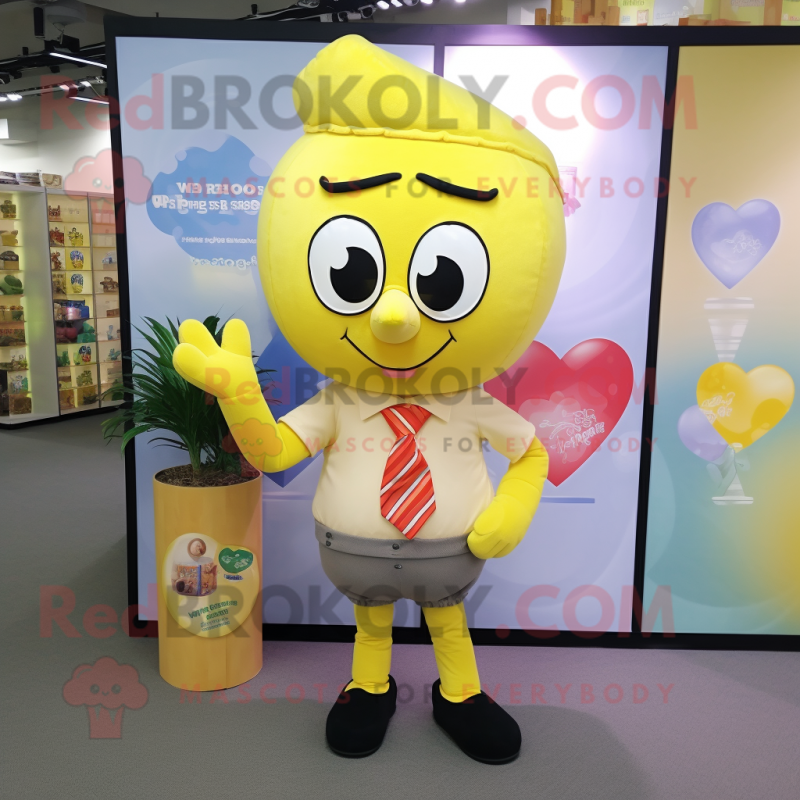 Lemon Yellow Heart mascot costume character dressed with a Oxford Shirt and Wraps Lemon Yellow Heart mascot costume character dressed with a Oxford Shirt and Wraps