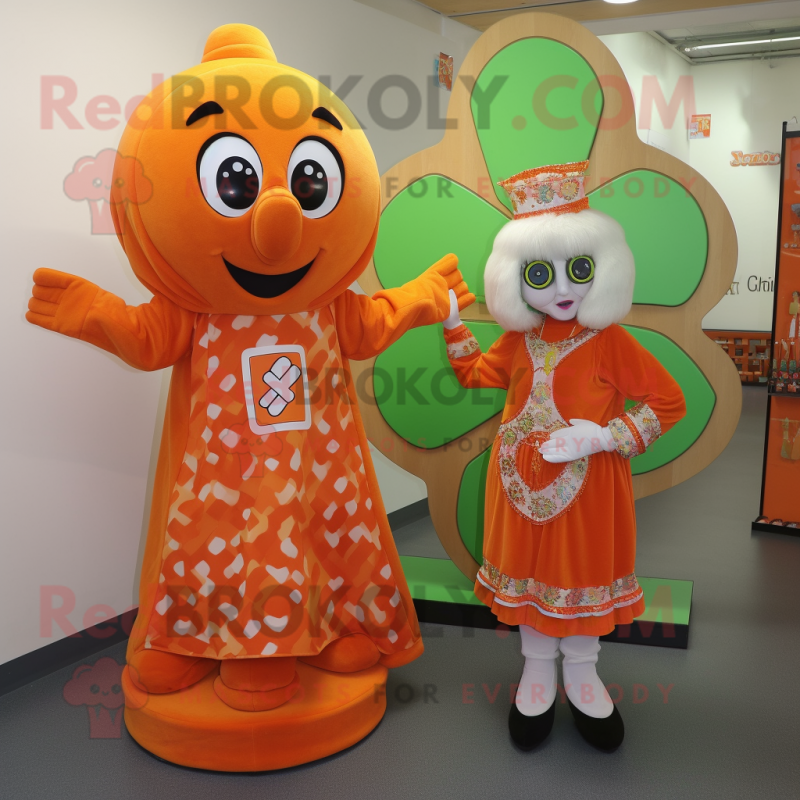 Orange Celtic Cross mascot costume character dressed with a Wrap Dress and Brooches Orange Celtic Cross mascot costume character dressed with a Wrap Dress and Brooches