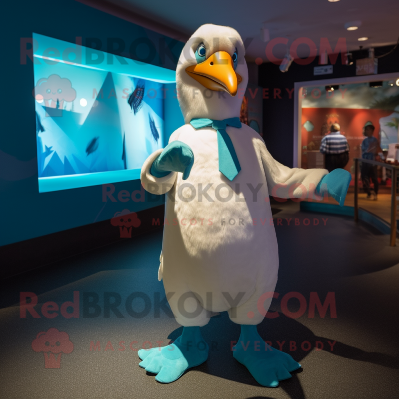Teal Albatross mascot costume character dressed with a Suit and Cummerbunds
