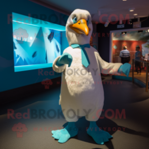 Teal Albatross mascot costume character dressed with a Suit and Cummerbunds