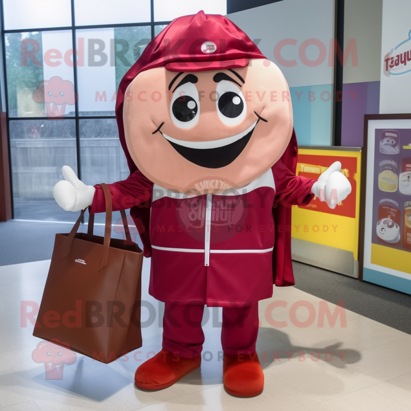 Maroon Candy Box mascot costume character dressed with a Windbreaker and Tote bags Maroon Candy Box mascot costume character dressed with a Windbreaker and Tote bags