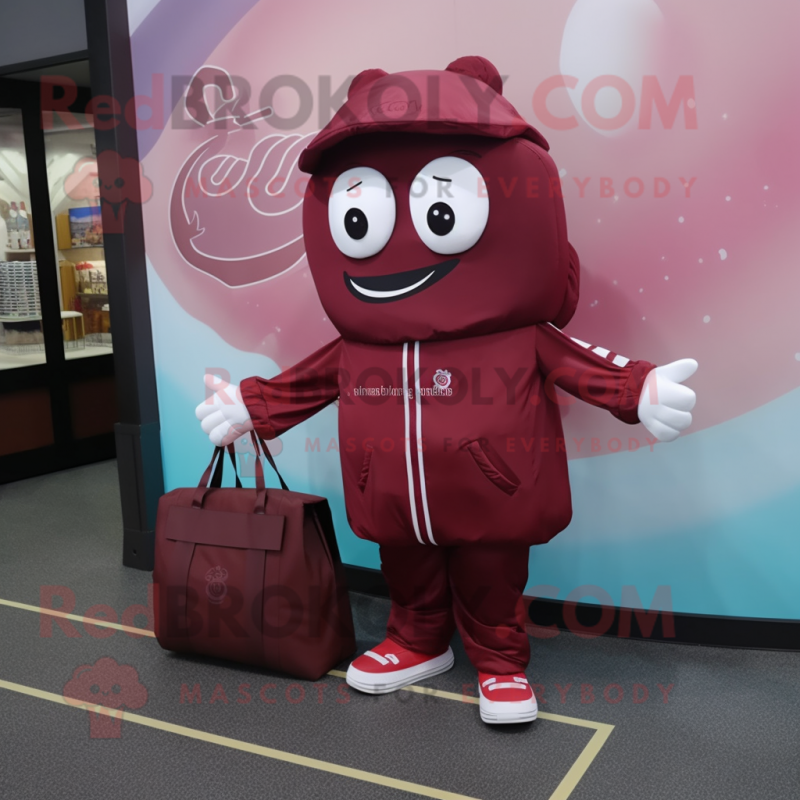 Maroon Candy Box mascot costume character dressed with a Windbreaker and Tote bags Maroon Candy Box mascot costume character dressed with a Windbreaker and Tote bags