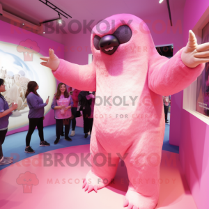 Pink Giant Sloth mascot costume character dressed with a One-Piece Swimsuit and Mittens