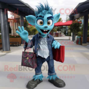 Teal Vampire mascot costume character dressed with a Chambray Shirt and Handbags