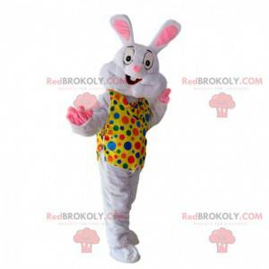White rabbit mascot with a yellow vest with colored dots -