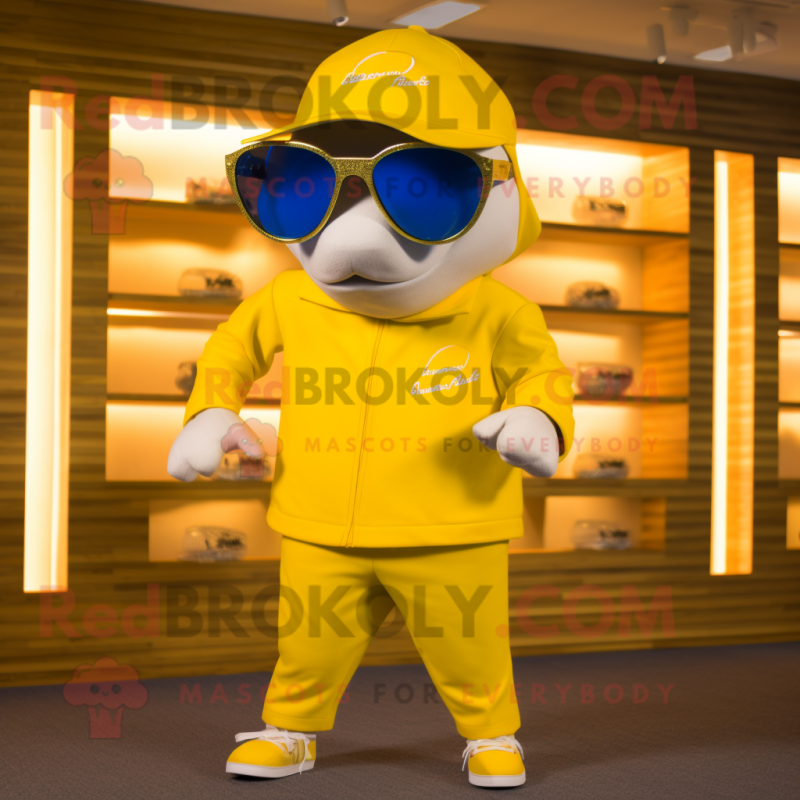 Gold Dolphin mascot costume character dressed with a Shorts and Sunglasses