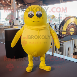 Lemon Yellow Human Cannon Ball mascot costume character dressed with a Sweatshirt and Suspenders