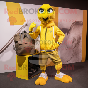 Yellow Eagle mascot costume character dressed with a Joggers and Messenger bags