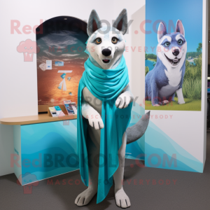 Turquoise Dingo mascot costume character dressed with a Bikini and Shawls