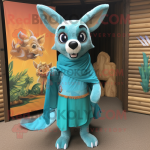 Turquoise Dingo mascot costume character dressed with a Bikini and Shawls