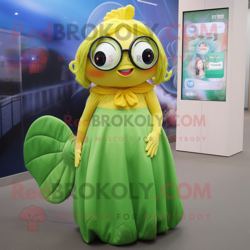 Olive Goldfish mascot costume character dressed with a Maxi Skirt and Eyeglasses