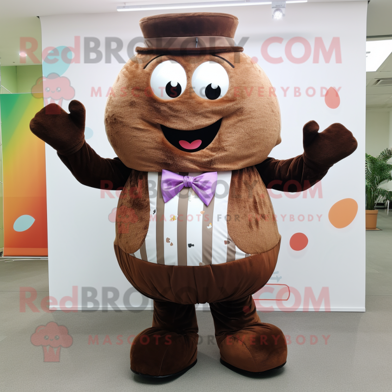 Brown Cupcake mascot costume character dressed with a Waistcoat and Suspenders Brown Cupcake mascot costume character dressed with a Waistcoat and Suspenders