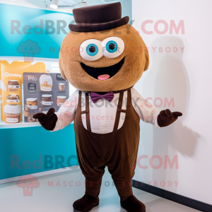 Brown Cupcake mascot costume character dressed with a Waistcoat and Suspenders