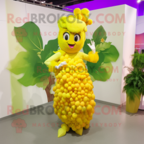 Yellow Grape mascot costume character dressed with a A-Line Skirt and Hairpins