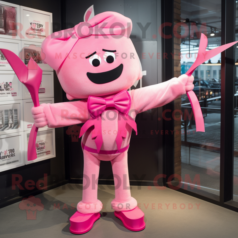 Pink Knife Thrower mascot costume character dressed with a T-Shirt and Bow ties