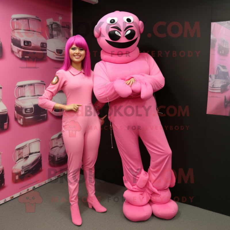 Pink Commando mascot costume character dressed with a Evening Gown and Anklets