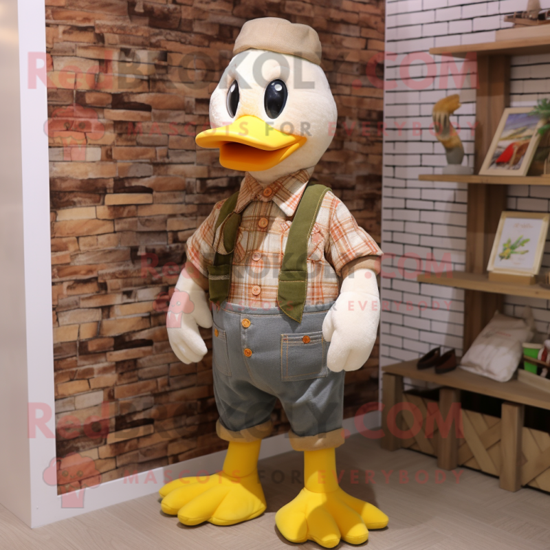 Beige Duck mascot costume character dressed with a Dungarees and Scarves