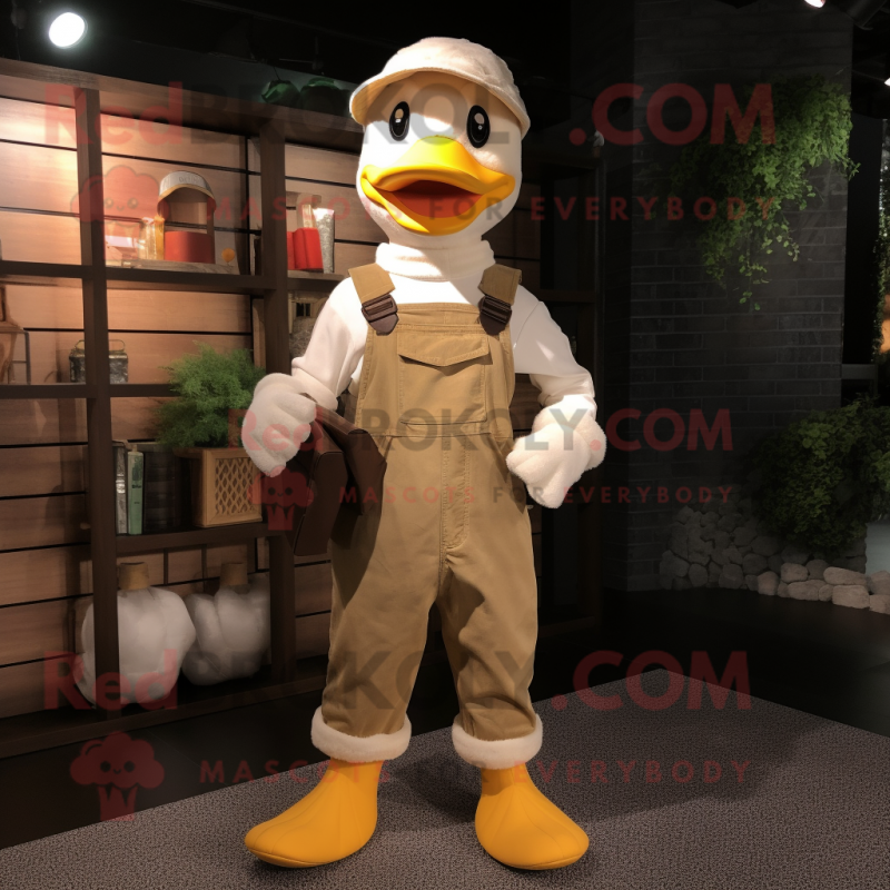 Beige Duck mascot costume character dressed with a Dungarees and Scarves