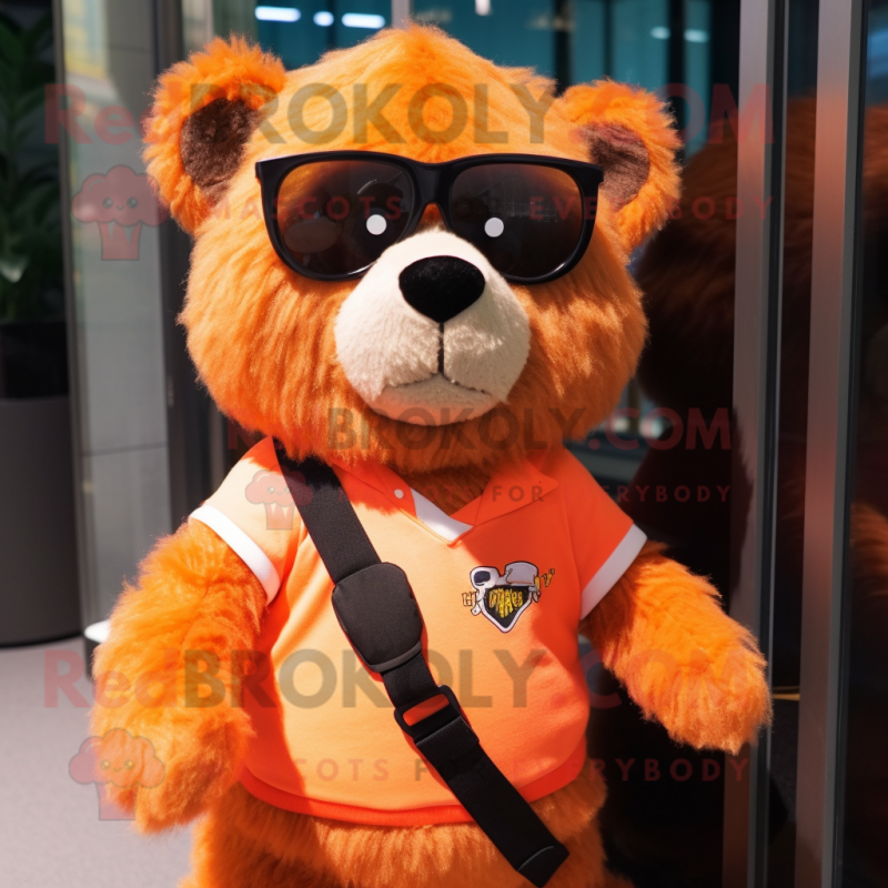 Orange Spectacled Bear mascot costume character dressed with a Romper and Keychains Orange Spectacled Bear mascot costume character dressed with a Romper and Keychains