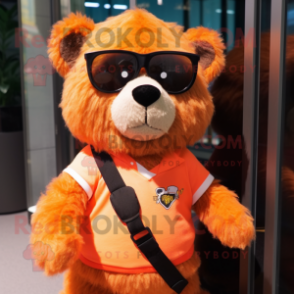 Orange Spectacled Bear mascot costume character dressed with a Romper and Keychains