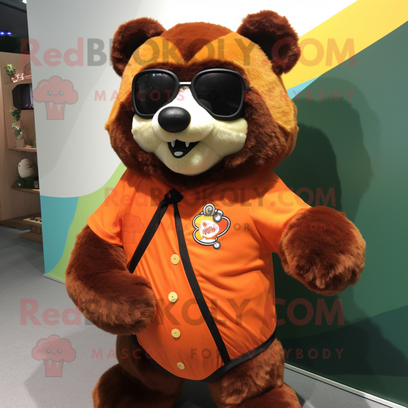 Orange Spectacled Bear mascot costume character dressed with a Romper and Keychains Orange Spectacled Bear mascot costume character dressed with a Romper and Keychains