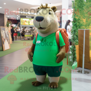 Forest Green Capybara mascot costume character dressed with a Graphic Tee and Messenger bags