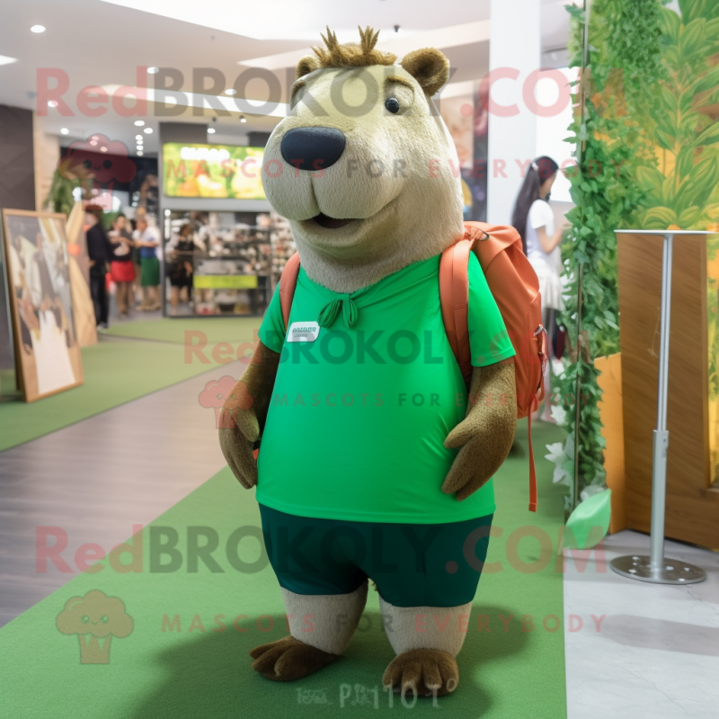 Forest Green Capybara mascot costume character dressed with a Graphic Tee and Messenger bags Forest Green Capybara mascot costume character dressed with a Graphic Tee and Messenger bags