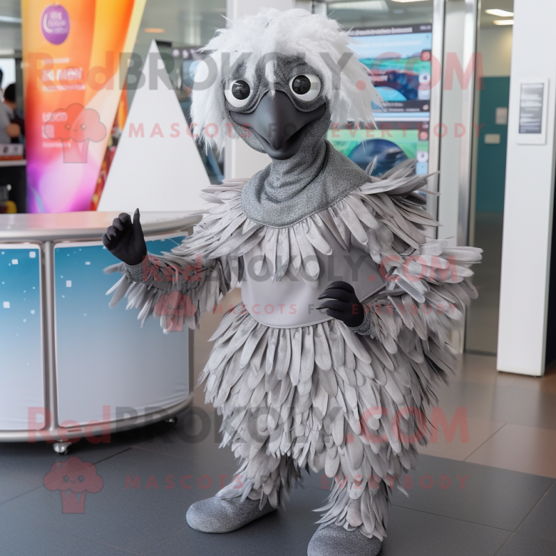 Silver Emu mascot costume character dressed with a Wrap Skirt and Backpacks