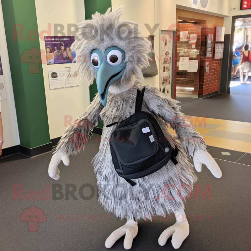 Silver Emu mascot costume character dressed with a Wrap Skirt and Backpacks