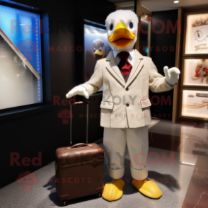 Beige Muscovy Duck mascot costume character dressed with a Suit and Messenger bags