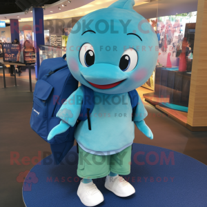 Teal Whale mascot costume character dressed with a Polo Shirt and Backpacks